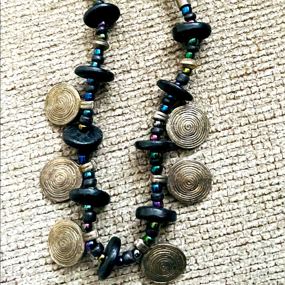 A multi color beads and silver charms necklace